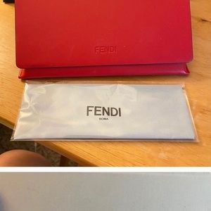 Fendi glass case and wipe. Brand new